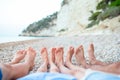 Closeup of the feet of family on the white sandy beach Royalty Free Stock Photo