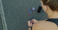 Closeup of feet of female runner getting ready tying running shoes with smartwatch, earphones and phone for music Royalty Free Stock Photo