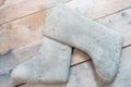 Closeup felt boots on wooden background. Old national traditional Russian winter footwear made of wool felt