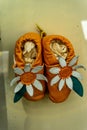 Closeup of felted slippers with flower decoration
