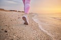 Closeup of female athlete runner feet along a sea coastline Royalty Free Stock Photo