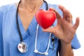 Closeup of female doctor cardiologist holding toy red heart Royalty Free Stock Photo