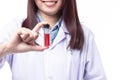 Closeup female doctor or nurse showing medicine vial isolated on white background. Healthcare and medicine concept Royalty Free Stock Photo