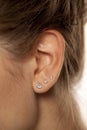 Female ear with earrings Royalty Free Stock Photo