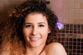 Closeup of female face smiling and taking a turkish bath Royalty Free Stock Photo