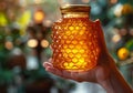 Closeup of female hand with a glass jar of honey. AI generated Royalty Free Stock Photo