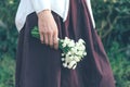 Closeup of female hand holding a bunch of snowdrops Royalty Free Stock Photo