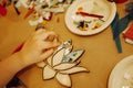 Closeup of female hand making a mosaic. The process of creating of a mosaic shape in the form of a lotus