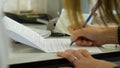 Closeup of a female hand writing on an blank notebook with a pen. Close-up of a female hand writing on an blank notebook Royalty Free Stock Photo