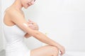 Closeup of female hands applying cream on her arm. Healthy skin, Beauty shot.