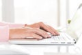 Closeup female hands typing on laptop keyboard. Woman working at Royalty Free Stock Photo