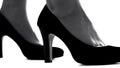 Closeup of female legs in high-heeled shoes, feminism concept, womens rights