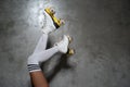 Closeup of female legs in vintage roller skates over concrete wall