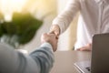 Closeup of female and male hand shaking, business partnership co Royalty Free Stock Photo