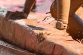 Closeup Female Muddy Hands Grabbing Barrier At Mud Run Event