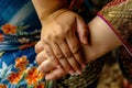 closeup of female sumo wrestlers hands gripping opponents mawashi