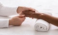 Closeup of female therapist making hand massage for african woman Royalty Free Stock Photo