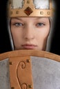 Closeup female warrior with helmet and shield Royalty Free Stock Photo