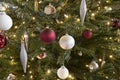 Closeup festive decorated Christmas tree balls lights Royalty Free Stock Photo