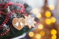 Closeup festive decoration for Christmas tree with warm bokeh lights on background. Royalty Free Stock Photo