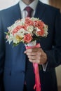 Closeup of a fiance in suit with wedding flowers Royalty Free Stock Photo