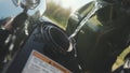 Closeup of fill gasoline motorcycle. Stock. Close-up of reflection of man in chrome detail of motorcycle. Motorcyclist