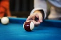 Closeup of finger on billard ball Royalty Free Stock Photo