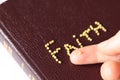 Closeup of finger holding mustard seed faith. Holy Bible concept of trust in God and Jesus Christ Royalty Free Stock Photo