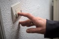 finger on light control at home - energy economy concept