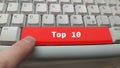 Closeup of a finger pointing to the Top 10 red button on the keyboard Royalty Free Stock Photo