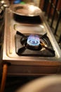 Closeup of the fire burner on the gas kitchen stove.