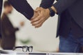 Closeup of a firm handshake between business partners after a successful negotiation meeting Royalty Free Stock Photo