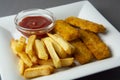 Closeup fish and chips with french fries - unhealthy food, grey backgrpound Royalty Free Stock Photo