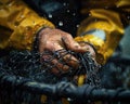Closeup of fisherman hands carefully repairing a fishing net. A day in the hard life of professional fishermen