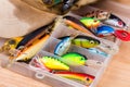 Closeup fishing baits wobblers in box