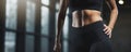 closeup of fit woman waist in black sports clothing with strong abdominal muscles at gym. banner