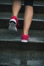 Closeup on fitness woman jogging in rainy city Royalty Free Stock Photo