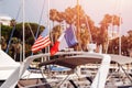 Closeup flags of France and United States on white yacht with light of sun Royalty Free Stock Photo