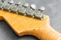 Closeup of flame maple headstock guitar Royalty Free Stock Photo