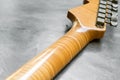 Closeup of flame maple headstock guitar Royalty Free Stock Photo