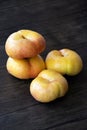 Closeup of flat peaches on the wooden table Royalty Free Stock Photo