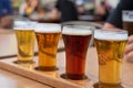 Closeup of a flight of cold beer on a restaurant table Royalty Free Stock Photo