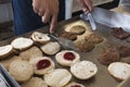 Closeup of flipping burger patties and warming buns on an old griddle at a burger joint Royalty Free Stock Photo