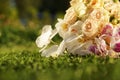 Closeup of flowers in a wedding bouquet, roses and orchids. Royalty Free Stock Photo