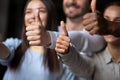 Closeup focus on hands diverse people showing thumbs up gesture Royalty Free Stock Photo