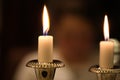 Closeup focus shot of antique candles on a dinner table Royalty Free Stock Photo
