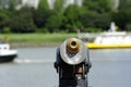 Closeup focus shot of a telescope overlooking a river scenery Royalty Free Stock Photo