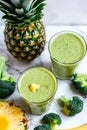 two glasses of brokkoli pineapple smoothies Royalty Free Stock Photo