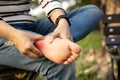 Closeup foot of an asian young woman holding her feet and massage with her hand suffer from tendon inflammation,female people sore