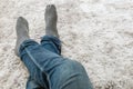 Closeup foot of man sit on gray carpet floor in house textured background with copy space Royalty Free Stock Photo